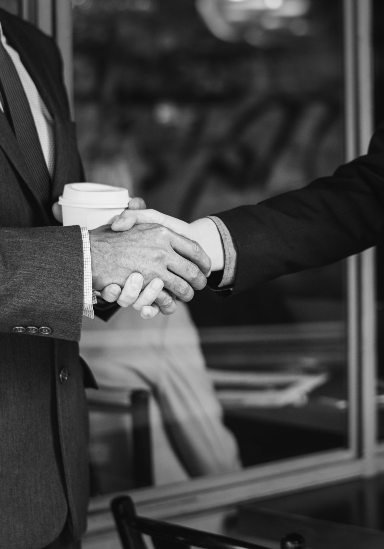 men-suits-shaking-hands